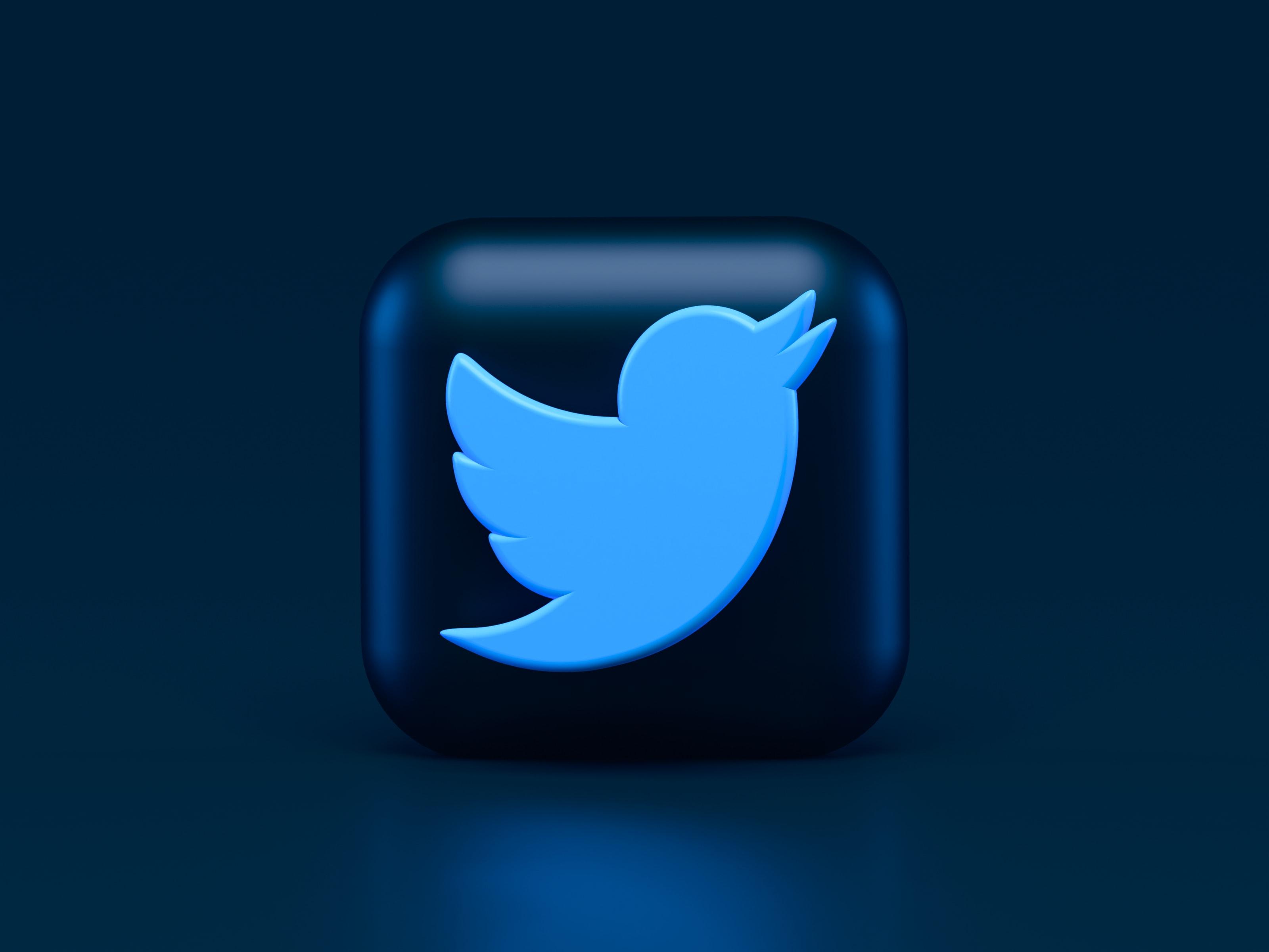 The logo of Twitter on a blue background